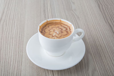 High angle view of cappuccino on table