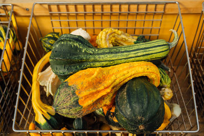 High angle view of squashes in metallic basket