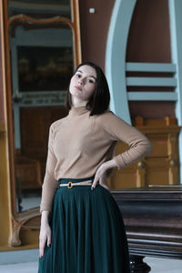 Portrait of young woman looking at camera