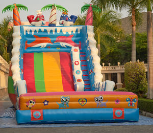 Multi colored deck chairs on palm trees