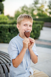 Portrait of smiling boy holding ice cream