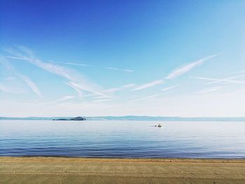 View of beach against blue sky