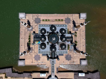 Aerial view of buildings against sea