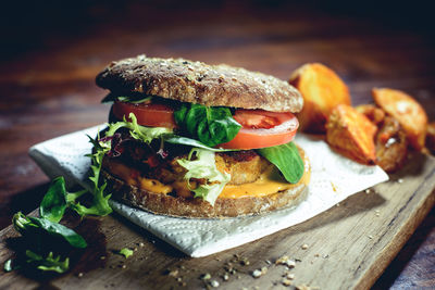 Close-up of burger on napkin on table