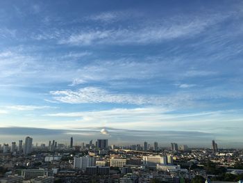 High angle view of buildings in city against sky