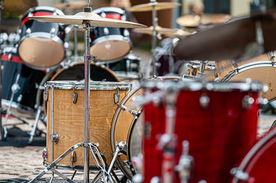 A set of plates in a drum set. at a concert of percussion music, selective focus, close-up