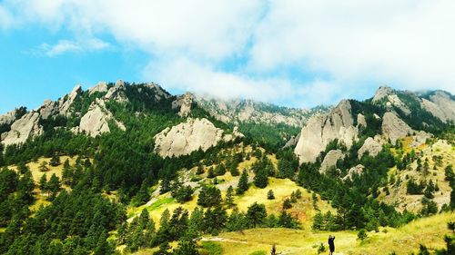 Scenic view of mountains against cloudy sky