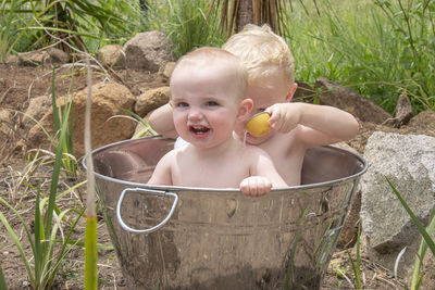 Cute boy looking away in bathtub