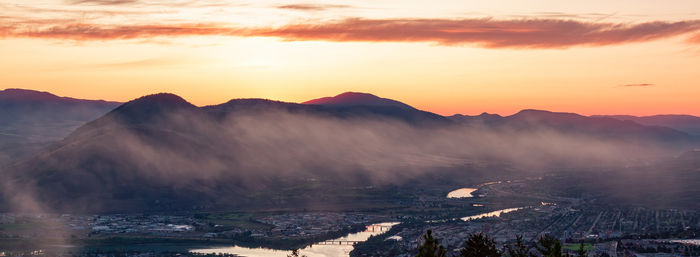 Scenic view of mountains against sky during sunset