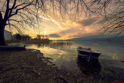 Scenic view of lake against sky during sunset