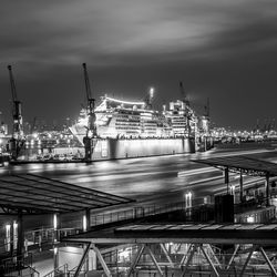 Side view of an illuminated ship in river