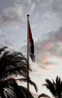 Low angle view of flag against sky