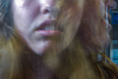 Close-up portrait of young woman looking away