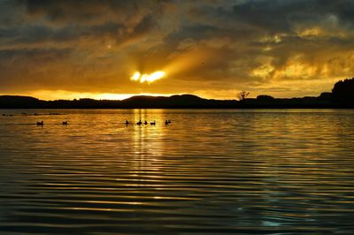 Scenic view of sunset over lake