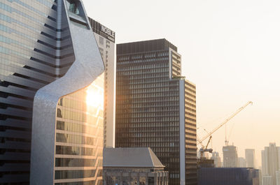 Low angle view of modern buildings against clear sky