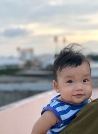 Portrait of cute boy looking away