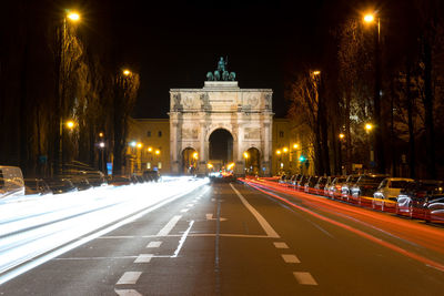 Light trails on road in city at night