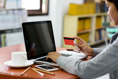 Man using laptop on table