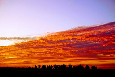 Scenic view of silhouette landscape against sky during sunset