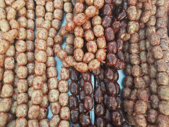 Thai style sausage, darker made by beef and lighter one made by pork. sai krok is that's name