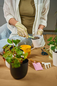 Midsection of woman holding bouquet