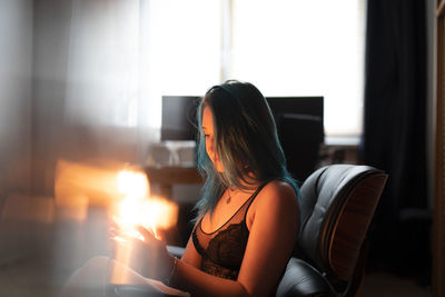 Woman sitting at home