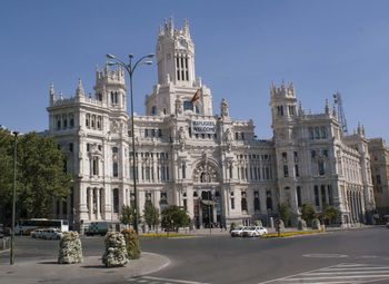 Buildings in city against clear sky