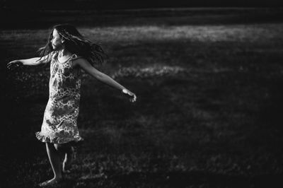 Girl dancing on field