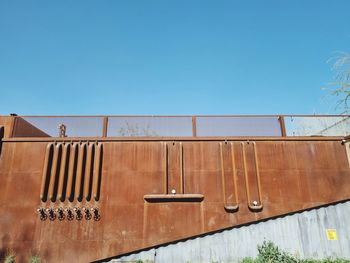 Low angle view of building against clear blue sky