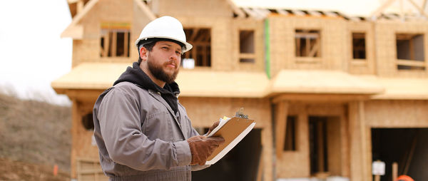 Side view of man using mobile phone