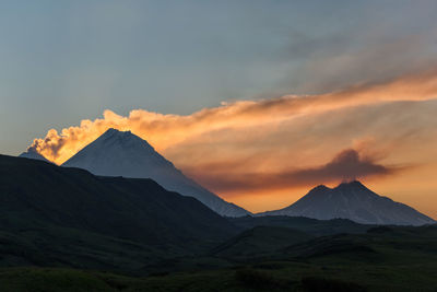 Scenic view of mountains against sky during sunset