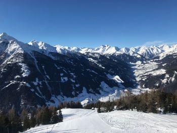 Snowcapped mountains against clear sky