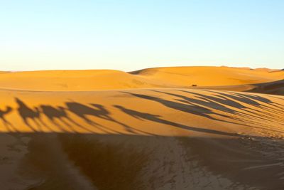 Scenic view of desert against clear sky