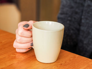 Close-up of coffee cup on table