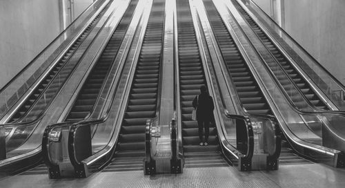 Woman on escalator