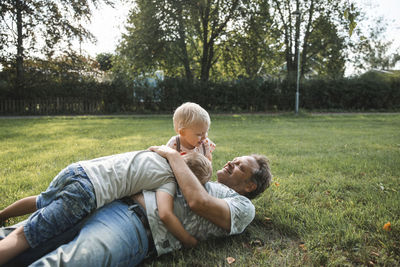 Father playing with sons