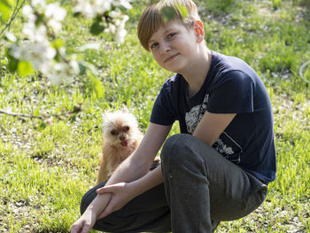 Portrait of boy with rodent