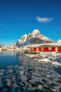 Scenic view of snowcapped mountains against clear blue sky