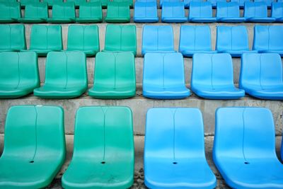 Full frame shot of blue seats in row
