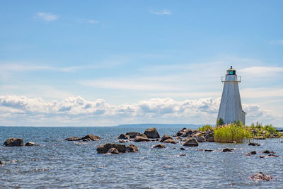 Beautiful summer day at a lake with a lighthouse