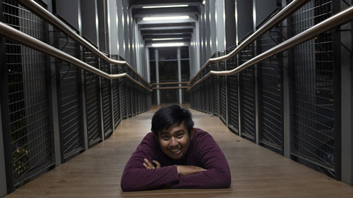 High angle view of young woman standing in building