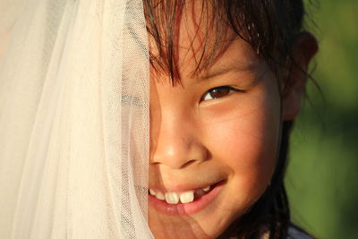 Close-up portrait of smiling girl