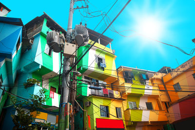 Low angle view of buildings against clear blue sky