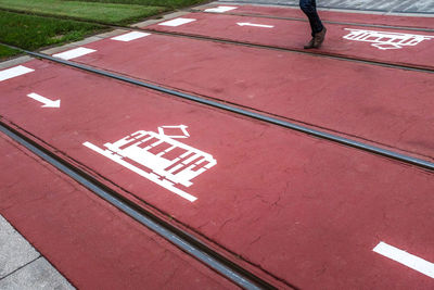 High angle view of arrow sign on road