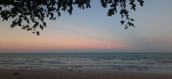 Scenic view of sea against clear sky during sunset