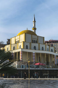 View of buildings in city against sky