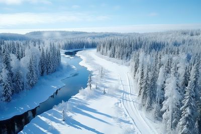 Scenic view of snow covered landscape against sky