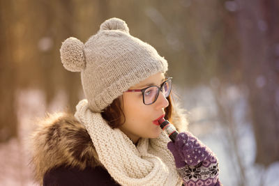 Close-up of young woman smoking