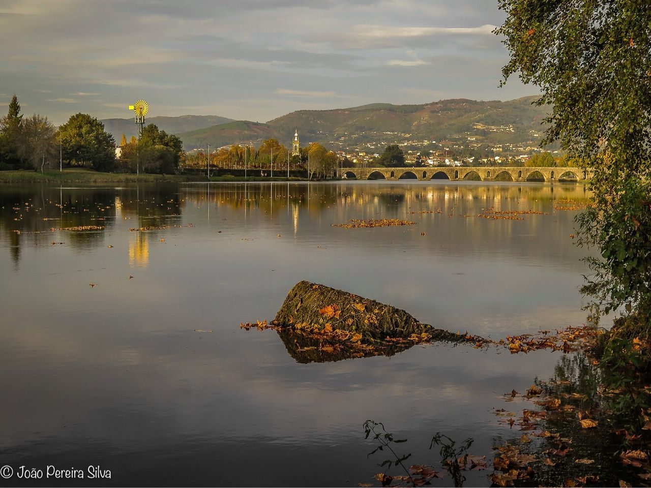 water, reflection, sky, nature, plant, lake, tranquility, tree, no people, beauty in nature, cloud - sky, scenics - nature, tranquil scene, waterfront, outdoors, non-urban scene, day, built structure, mountain, pollution