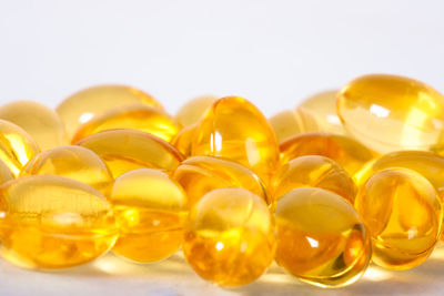 Close-up of yellow eggs against white background